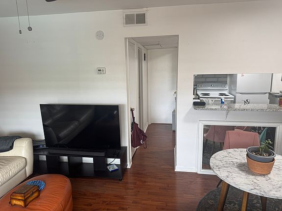 More living/eat in dining room, kitchen through window