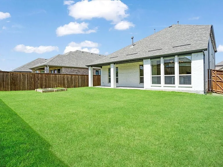 Expansive backyardample space for outdoor living, and play.