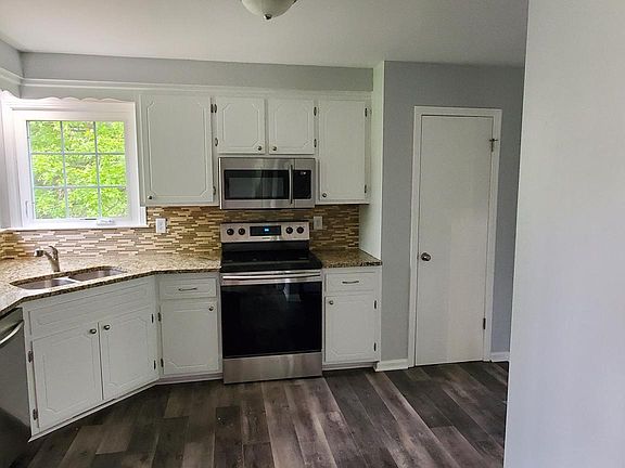 spacious kitchen with all new stainless steel appliances!