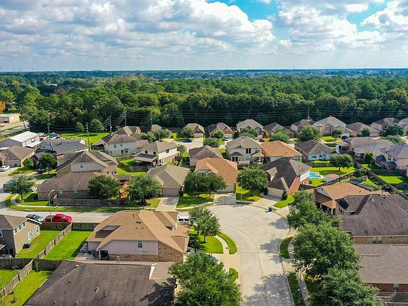 Here we have a beautiful aerial view of the home w/ a look at the peaceful community it's located in. The community of Northcrest Village is located between Kuykendahl & Spring Stuebner Rd.