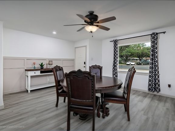 Dining table in front room next to picture window
