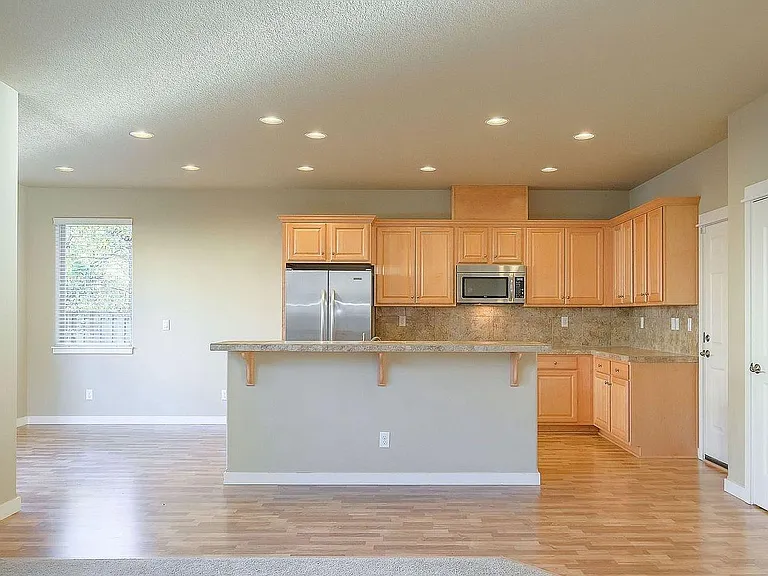 6387 NE Meadowgate Ct — Photo 3