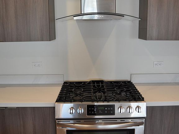 Stainless steel slide-in range and hood