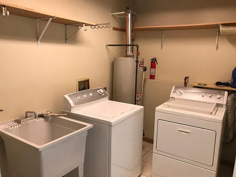 Laundry Room w/ Washer & Dryer, Utility Sink, Crawl Space & Storage