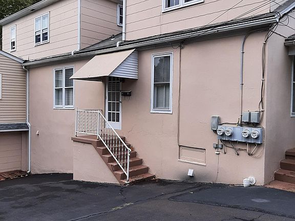 Outside Picture. Parking spot and stairs going up to the upstairs unit.
