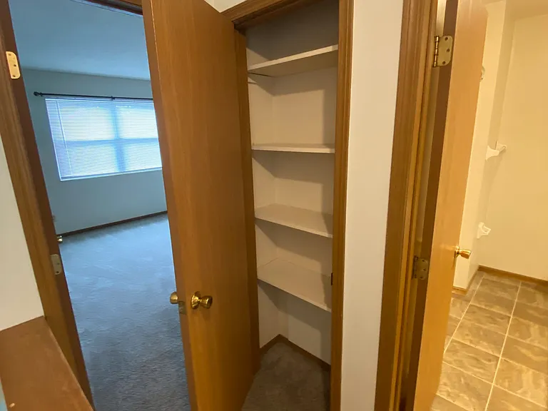 Second story hallway; looking into second bedroom, linen closet and full bathroom