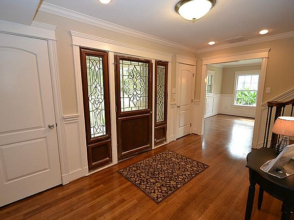 FORMAL ENTRY... ANOTHER VIEW OF THE FORMAL ENTRY... 2 SETS OF COAT CLOSETS BANK BOTH SIDES OF THE OR