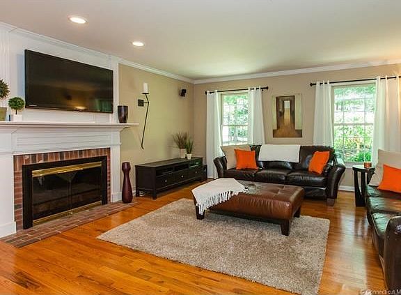 Family room with gas fireplace crown molding.