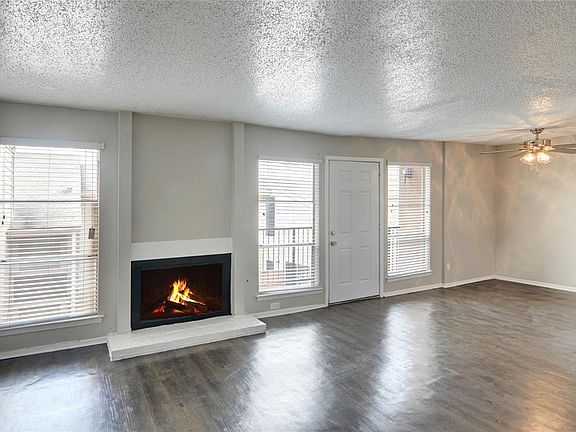 LIVING ROOM WITH WOOD BURNING FIREPLACE