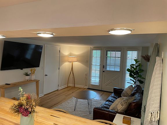 Door to private laundry is to the right of the tv