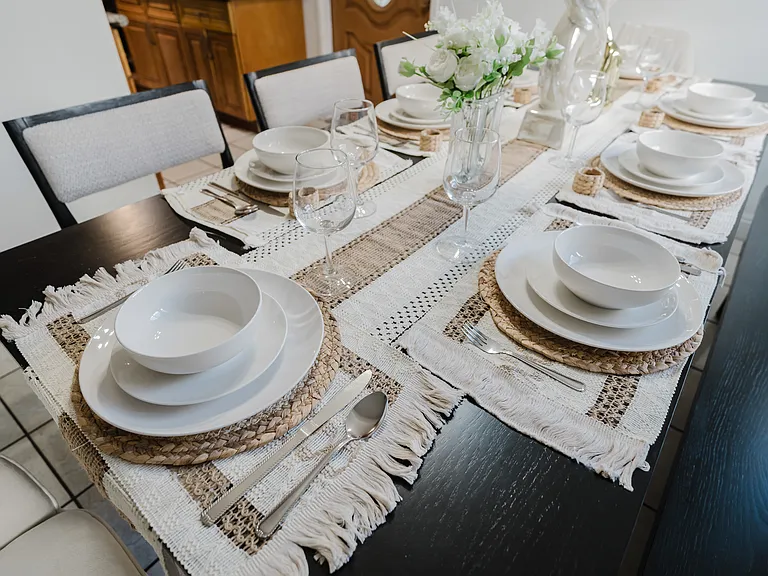 Elegant dining table set with silverware, perfect for a refined dining experience.