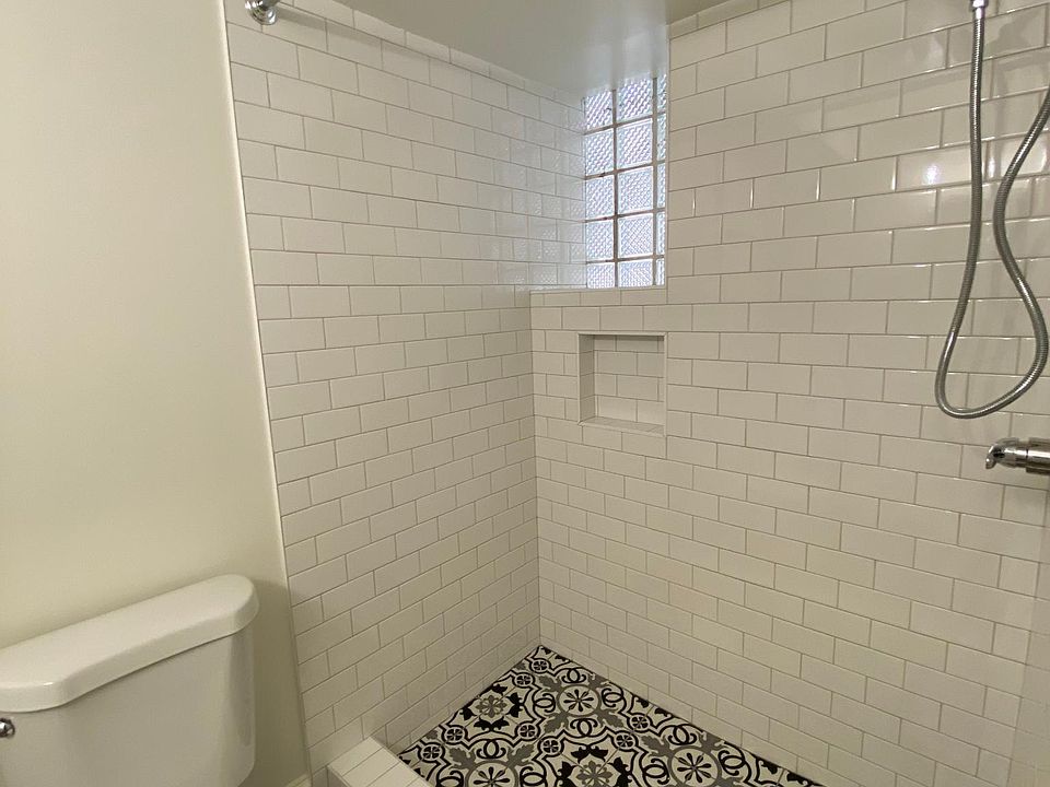 Bathroom with tiled shower.