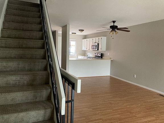 Stairs to top floor. Living/Dining and kitchen. Great breakfast bar.