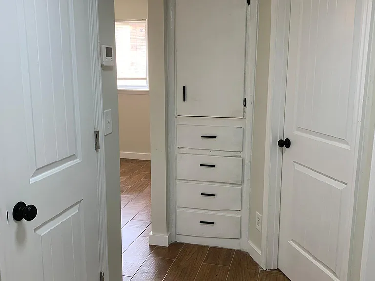 Entry hallway, linen closet, furnace closet