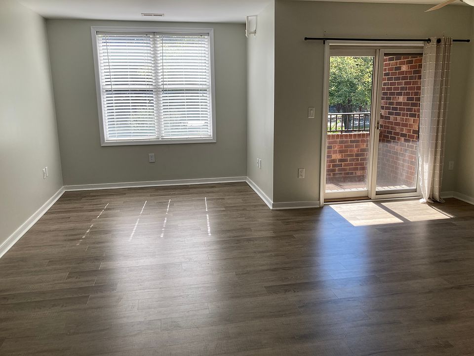 Open living and dining areas with sliding glass door access to private balcony.