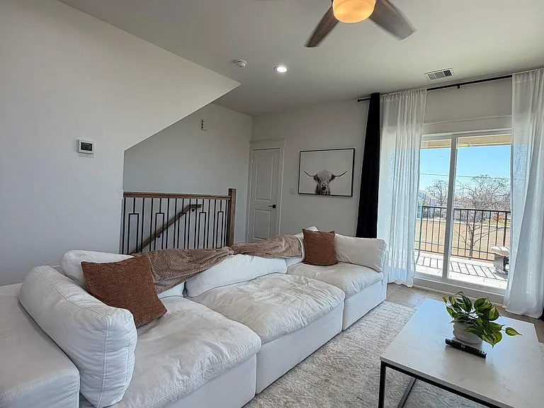 Relax and enjoy our deep seated designer sofa and streaming services on our 70 inch tv.