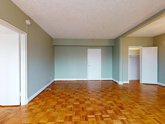 Looking back at entryway door and coat closet
