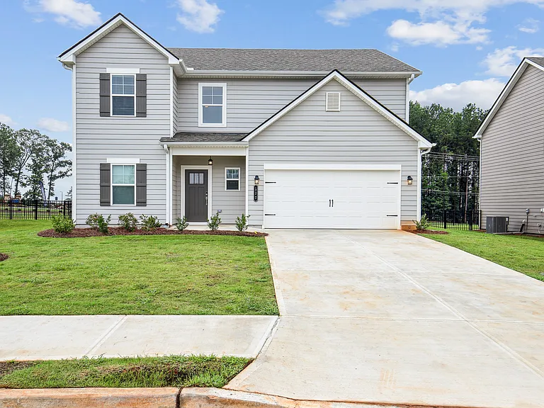 Exterior of the Hastings, two story home with a private driveway and attached garage.