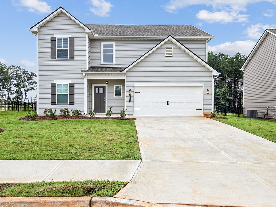 Exterior of the Hastings, two story home with a private driveway and attached garage.