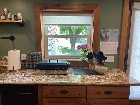 Kitchen view, lots of storage in the chicory wood cabinets with pullouts below.