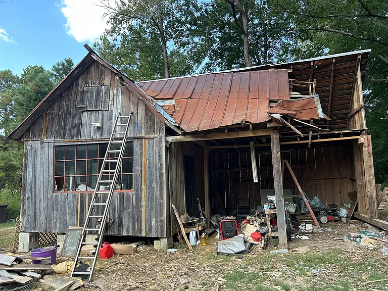 1920's building hit by a tree on September 13th. Rebuilding with clesterary ceiling adding four feet hight to second story area above two stalls