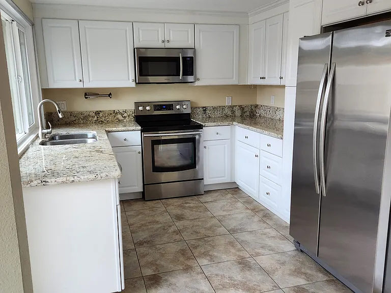 Kitchen with stainless steel appliances.