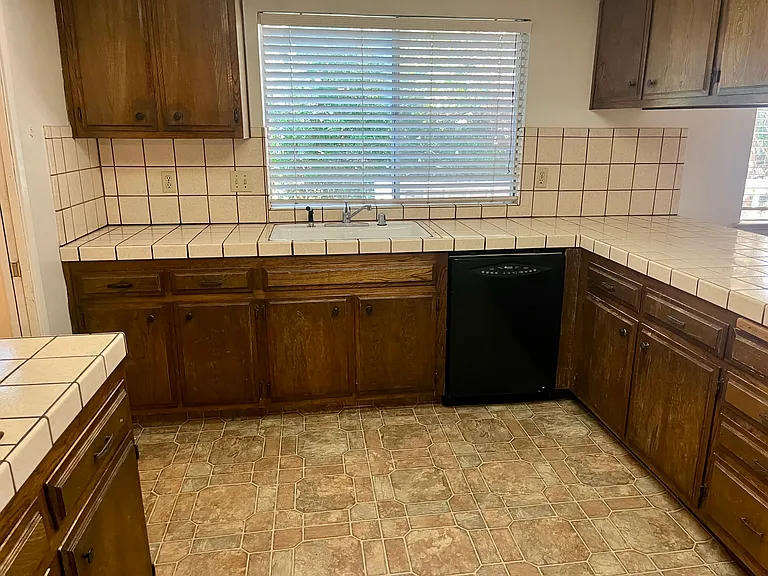 A spacious kitchen with ample storage.