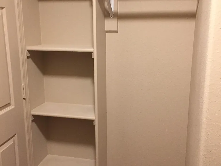 Walk-in closet in 1st master bedroom