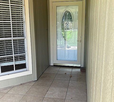 Glass storm door