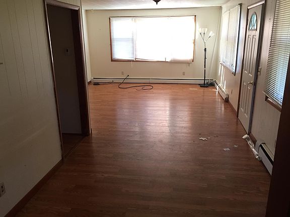 Looking from the dining room into the living room