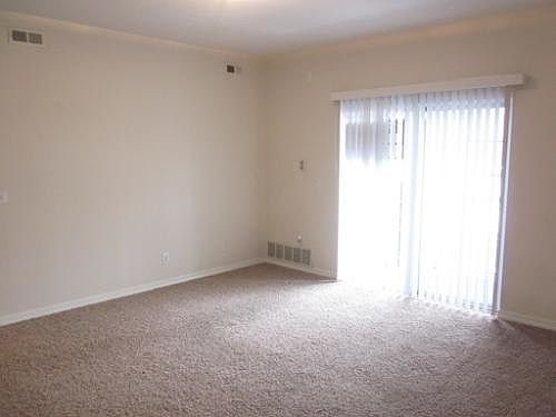Living room. It is now updated with darker new carpet