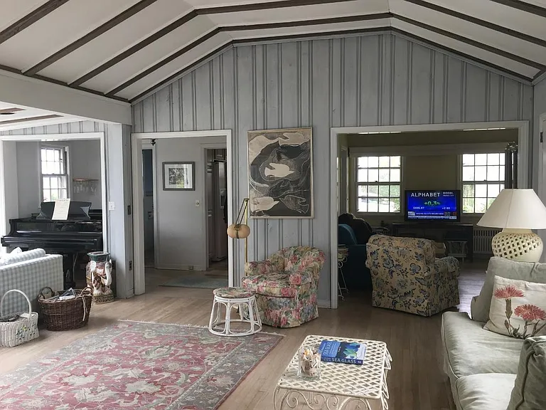 Great Room looking into the TV room/den. To the left in this photo are the sliders to the deck and unobstructed views of the beach/water