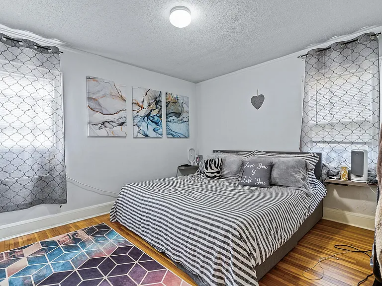 Main floor bedroom provides both privacy and a lovely view of outdoor spaces.