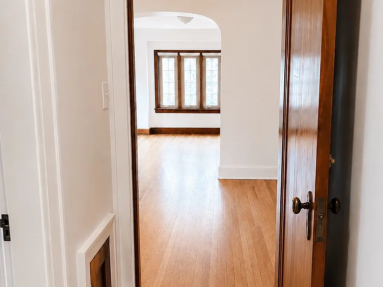 Hallway, showing dining room and living room beyond