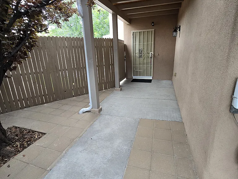 Front door with a second front gate with lock with access to the back yard,