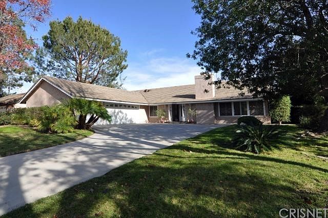 Front view showing 3 car garage