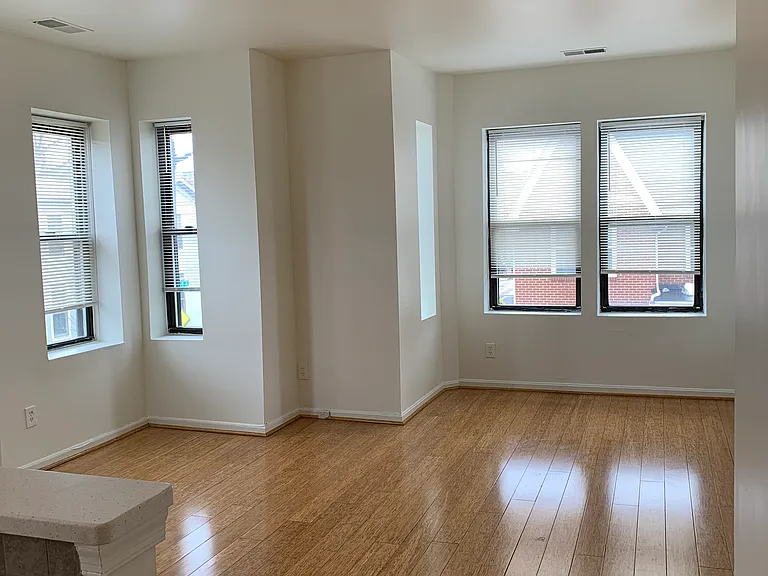Livingroom, lots of light, opens. to kitchen. Ceiling fan, Beautiful bamboo flooring.