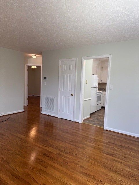 View from front door.
Coat closet with light behind closed door.