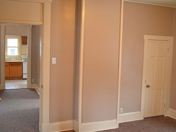 Downstairs Bedroom looking towards Living Room & Kitchen