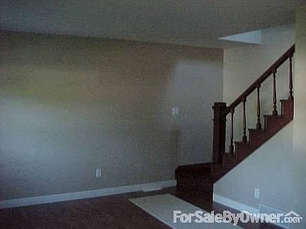 living room,open staircase, wood floors