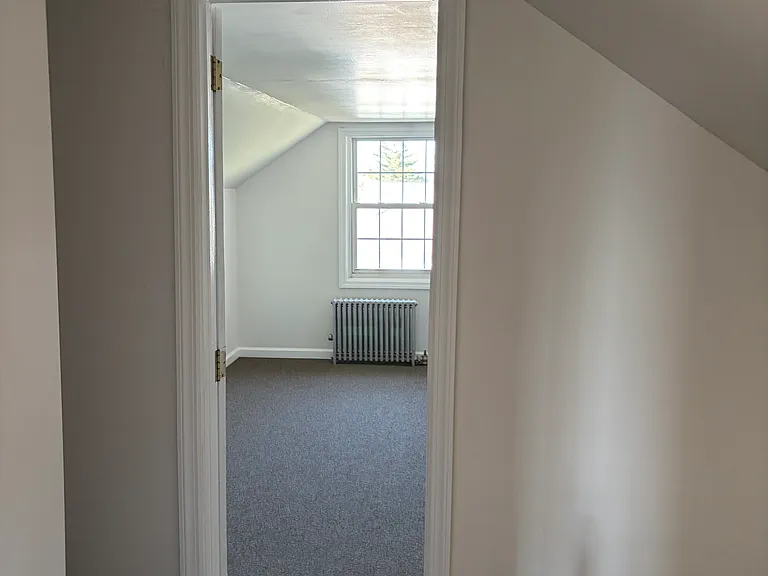 Bedroom two, fresh paint and brand new carpet on second floor bedroom area.