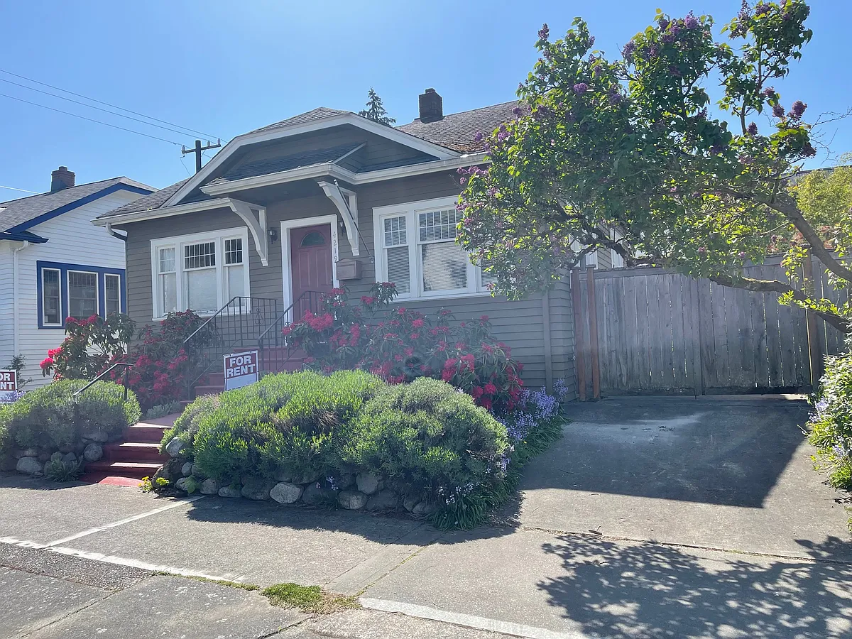 lots of flowers in from yard of light filled craftsmen house. - 4219 SW Juneau St