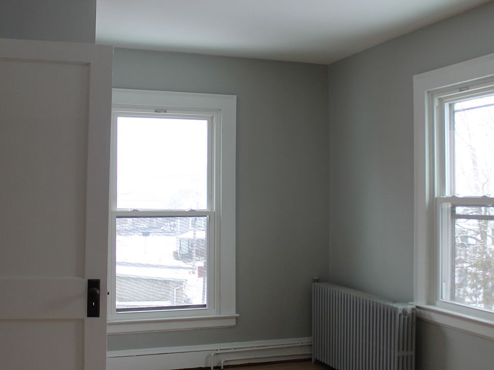 Bedroom located at rear of apartment, north side. 3 windows and a closet.