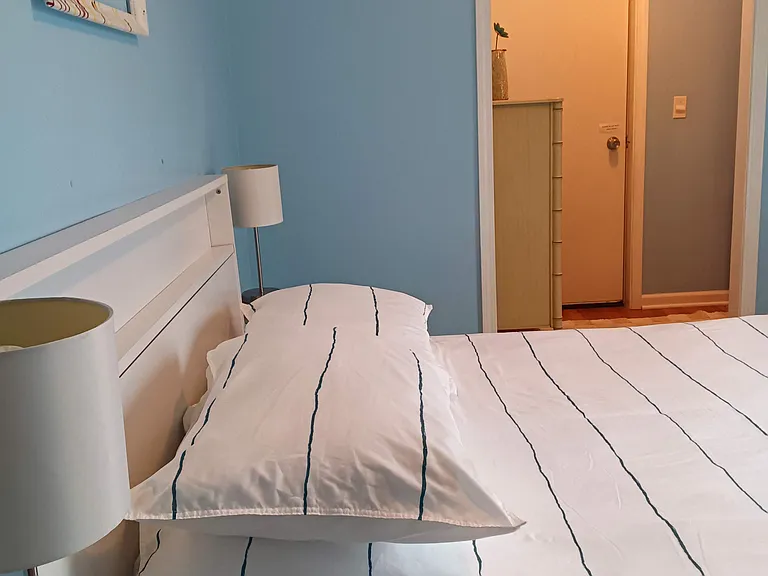 5 drawer dresser in cubby with 5 shelf organizer opposite end