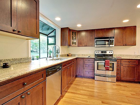 All new stainless appliances, cabinets, slab granite countertops.