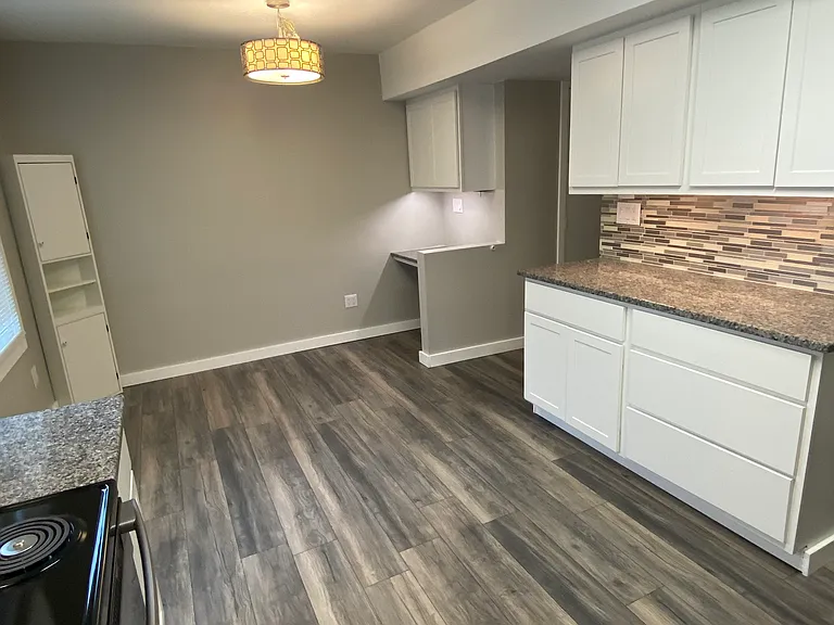 Dining & work-from-home station full view
Wood flooring throughout downstairs