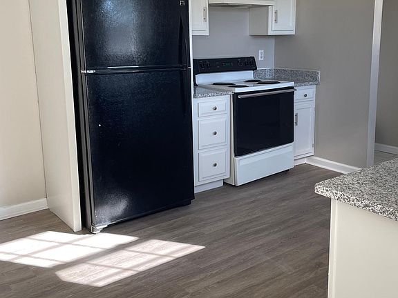 Kitchen with brand new granite countertops.