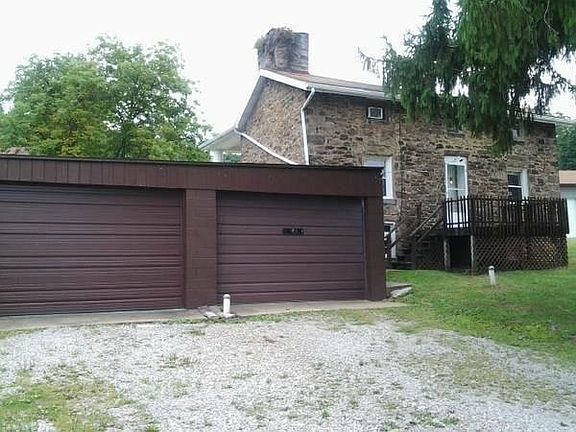 Private driveway located behind house with lrge 2 car garage