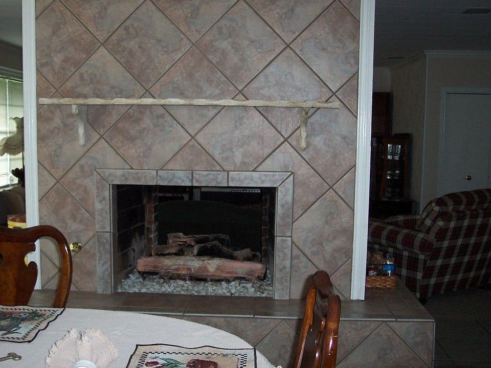 gas fireplace goes from dining room through to living room