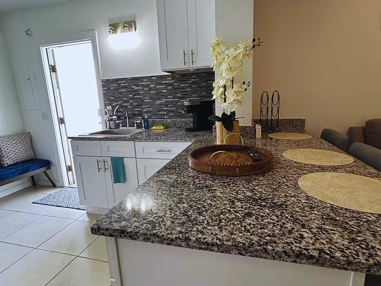 Breakfast bar with beautiful placemats and stylish decor for added comfort. Lakeland, FL